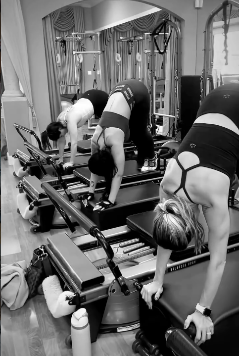 Small group reformer Pilates class with Natalia